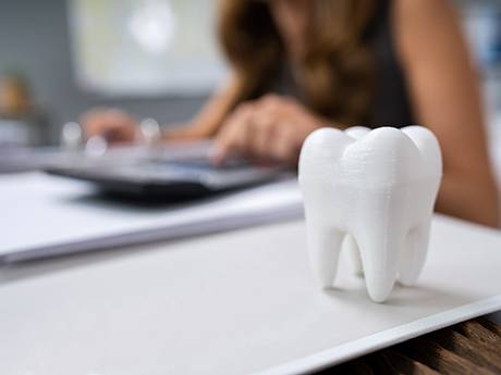 patient calculating cost of emergency dentistry in Marysville