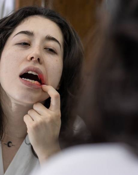 Patient in Marysville checking their gums for gum disease