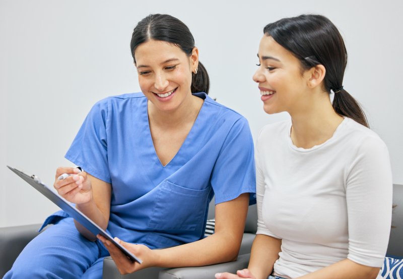 patient discussing dental insurance with staff member